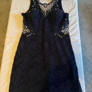 Dark Navy Blue homecoming dress with lace cut outs and rhinestones.